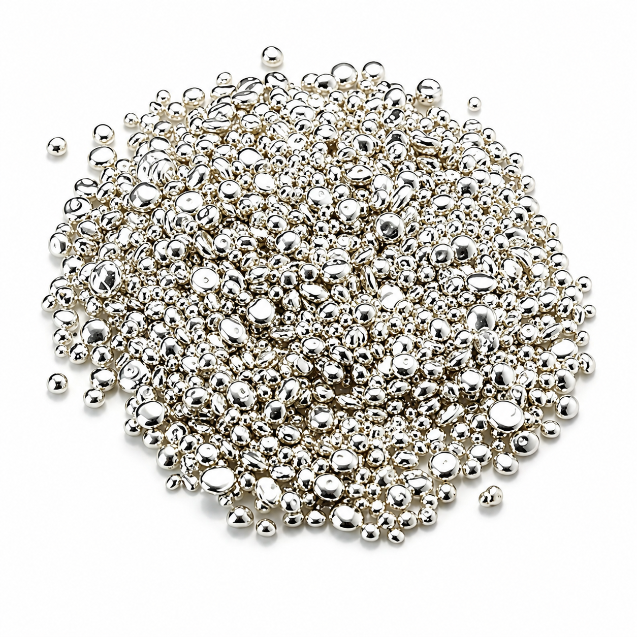Pile of shiny silver metallic beads on white