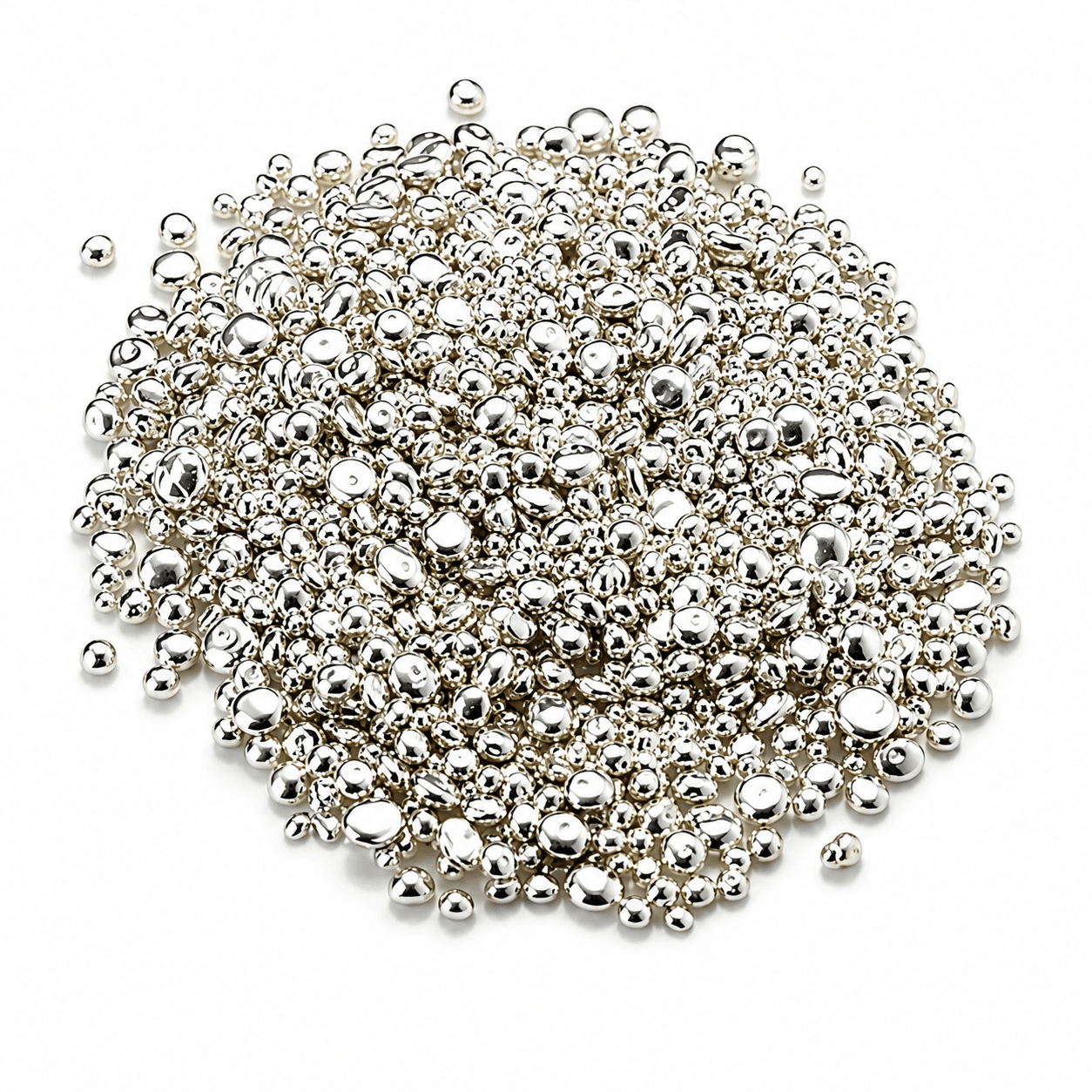 Pile of shiny silver metallic beads on white